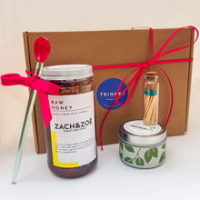 Load image into Gallery viewer, Gift box with jar of honey, decorative glass spoon, small candle, and jar of matches on a light background